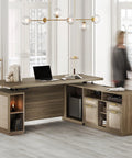 70 Inch L Shaped Electric Standing Desk With Heavy Duty Steel Frame And Smooth As Silk Height Adjustments Features Four Smart Memory Presets Built In File Cabinet AC USB Charging Ports Privacy Panel For An Ultimate Game Changer Workspace In Natural Oak in modern office setting.