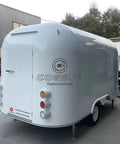 Heavy Duty Polished Mirror Food Trailer With Foldout Awning Fully Customizable Layout, back view showing sleek design and lights.