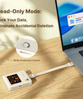 Classic Retro M2 NVMe PCIe Magnetic SSD Enclosure with LCD showing write protection switch next to laptop on wooden desk.