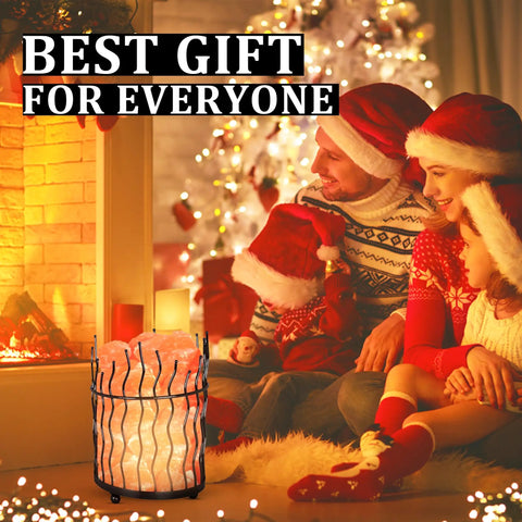 Family enjoying Pink Himalayan Salt Lamp With Dimmer Switch In A Tall Round Metal Basket, 8 To 10 Lbs by fireplace