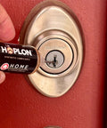 Applying All-In-One 5oz Synthetic Ester Lubricant Spray With Precision Needle to a door lock, showing detailed application.