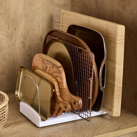 StoreMore Adjustable Bakeware Rack with steel wires and seven adjustable dividers organizing cutting boards and trays in a cabinet