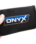 Hand holding Onyx pouch for Pro Grade Do It All RC Tool Set For Air And Surface Startups with Aluminum Handle and Zipper Case.