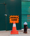 Heavy Duty Plastic Sidewalk Closed Signs Bulk 6 Pack Rock Solid Traffic Control Board near closed gate with traffic cone and hydrant.