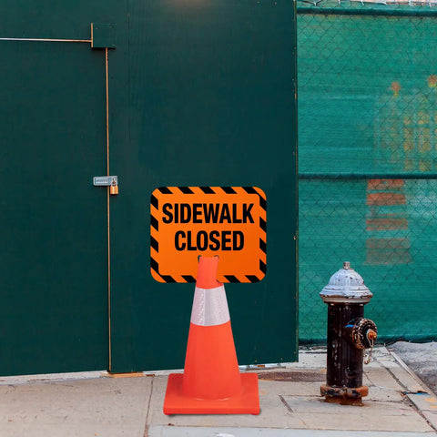 Heavy Duty Plastic Sidewalk Closed Signs Bulk 6 Pack Rock Solid Traffic Control Board near closed gate with traffic cone and hydrant.