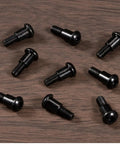 12 Pcs Black M3x10mm Hex Buttonhead Shoulder Screws crafted from tough 12.9 grade alloy steel, arranged on wooden surface.