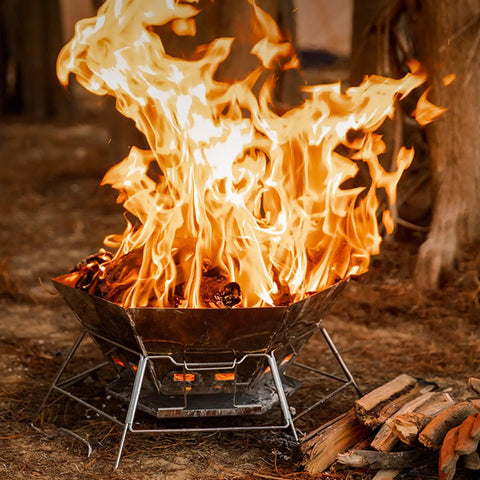 Hexagonal 430 Stainless Steel Folding Fire Pit Burn Barrel For Wood Fires in use outdoors with flames and log pile nearby