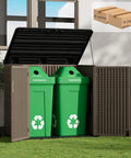 Spacious Outdoor Storage Shed Resin Cabinet With 48 Cu Ft Capacity For Patio Accessories Trash Cans And Garden Tools Durable Weather Resistant With Lockable Lid And Easy Access shown holding green recycle bins