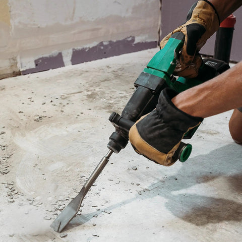 Man using 18V MultiVolt Rotary Hammer Tool Body Only No Battery Included With 1-1/32 Inch SDS Plus Chuck on concrete floor