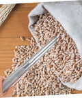 Stainless Steel Grain Sampler Probe Tool With Rubber Grip For Outdoor Gardening And Farm Use in a bag of grains on wooden table
