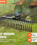 Tow Behind Landscape Rake 60 Inch Dethatcher with 21 steel coil tines shown attached to tractor in a grassy field