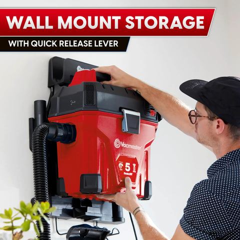 Installing 5 Gallon Wall Mount Wet Dry Vacuum With Remote Control Handle, 5 Peak HP, red housing on wall with quick release lever