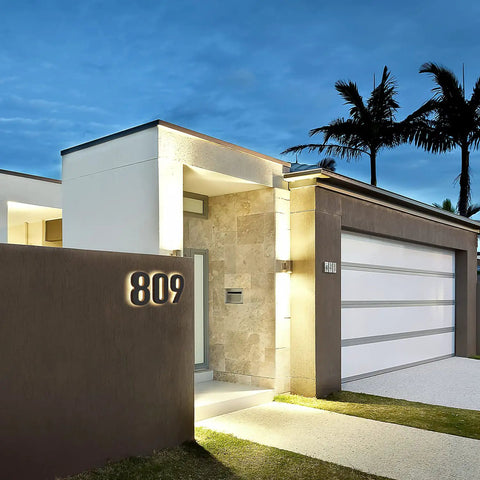 Modern house exterior with glowing 8 Inch LED House Numbers Set 12V DC Low Voltage Address Numbers, waterproof, easy to install.