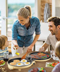 Family cooking with Bear 11.8 Inch 1500W Electric Smokeless Indoor Grill With Adjustable Temp Control Nonstick Pan.