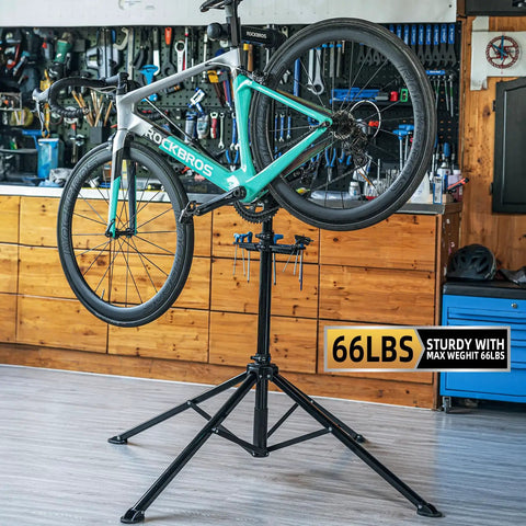 Beast Bike Repair Stand Up To 66 Lbs Aluminum Alloy Portable Home Shop Maintenance Stand lifting a bike in a garage.