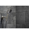 Statement VES Handshower Holder With Supply, Magnetic Dock, on gray tile wall, built-to-last premium metal.