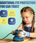 Young girl wearing Six Crew Pack Youth Safety Glasses With Anti Fog And Uv400 Tint built tough, using a sander for projects.