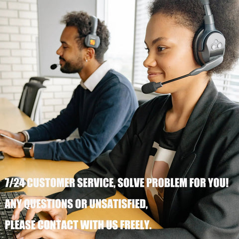 Side view of two customer service representatives wearing black headsets at a wooden desk.