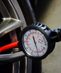 Using 3081 Dial Tire Inflator With 3 In 1 Inflate Deflate And Pressure Gauge on car tire with pro-grade aluminum die-cast body.
