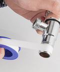 PTFE Plumbers Tape Two Pack 0.5 Inch Wide Teflon Tape For Pipe Thread Sealing And Keeps Leaks At Bay On Shower Heads Garden Hoses And All Plumbing Connections Durable Heat Resistant And Easy To Use applied to a metal pipe.