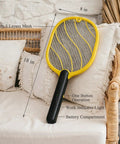 Next Level Handheld Bug Zapper Racket With Batteries Included, Safe Three Layer Mesh on a couch, black handle, home setting