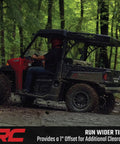 Upgrade Your Polaris UTV Setup With These Heavy Duty 4x156 To 4x136 Wheel Adapters That Drop Your Can Am Rims A Full Inch For Wide Tire Flex Meaner Fitments And Fresh Off Road Stance In Pairs - UTV driving on a muddy trail.
