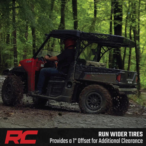 Upgrade Your Polaris UTV Setup With These Heavy Duty 4x156 To 4x136 Wheel Adapters That Drop Your Can Am Rims A Full Inch For Wide Tire Flex Meaner Fitments And Fresh Off Road Stance In Pairs - UTV driving on a muddy trail.