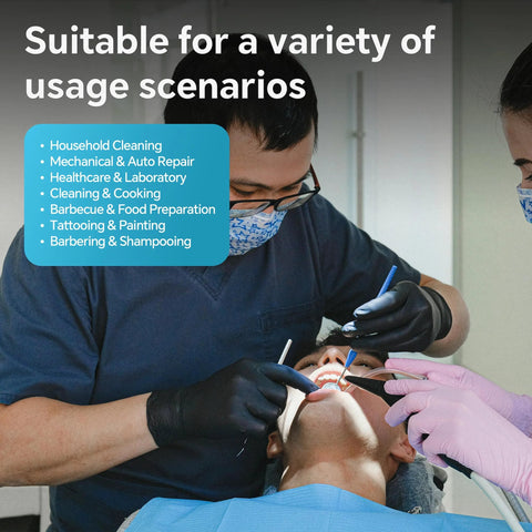 Front view of dentist wearing black nitrile disposable gloves during a dental procedure on a patient.