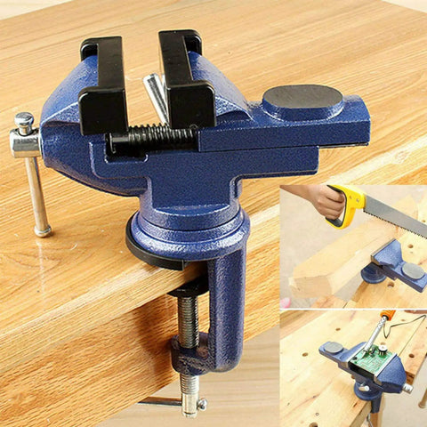 360 Degree Rotating Bench Vise For Woodworking And DIY, 2.5 Inch Cast Iron Table Vise Clamp, Heavy Duty Grip With 0 To 2.5 Inch Jaw Opening, Built Tough For Hobbyists And Makers. Blue cast iron bench vise clamped to a wooden workbench