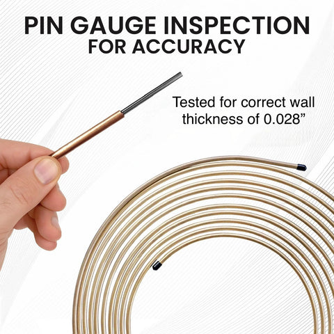 Front view: hand holding cut end of copper-nickel brake line coil, 25 ft, 3/16 in diameter, .028 in wall, with fittings