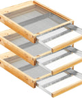 Three fully assembled, beeswax dipped, 10-frame beehive metal screened bottom boards with entrance reducers stacked neatly.