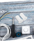 Stylish Silicone Wall Cable Plugs For Decor Hiding Messy Cords And A/C Sleeves Easy Install Kit Without Tools To Blend Seamlessly With Interior Walls In American Style Homes Today. White silicone wall cable plugs with cords, screwdriver, and wall plate