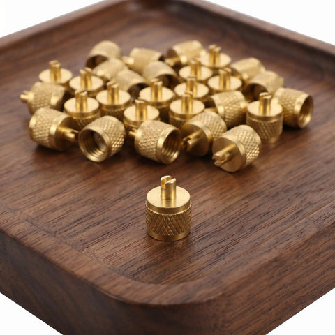 Professional Grade Beefy Brass Refrigeration Valve Caps With Slick Knurled Nozzles For Ac Systems And Coolant Lines Leak Proof Field Service Covers No Sweat Maintenance 30 Pack on a wooden tray.