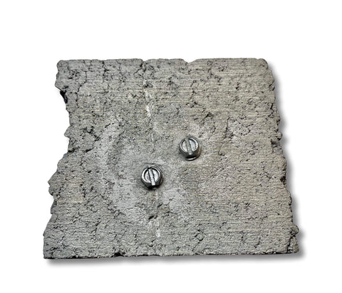 Self Drilling Concrete Screws Quarter Inch By Three Inch Steel With Tungsten Carbide Tip 15 Pack installed in concrete block