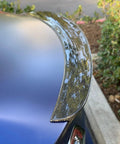 Real Molded Carbon Fiber Matte Dry Look Spoiler For Tesla Model 3, side view showcasing aerodynamic design and glossy finish.
