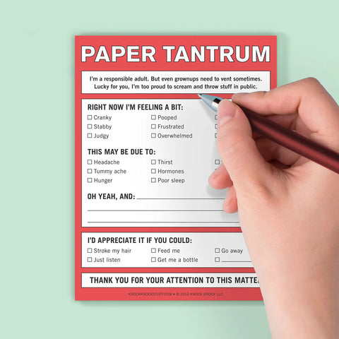 Person writing on Paper Tantrum Nifty Note Pad Classic Edition with 50 Sheets, featuring passive aggressive notes, 4x5.25 inches.