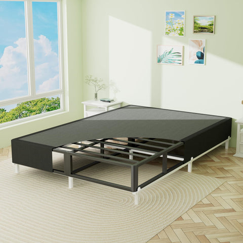 Heavy Duty King Box Spring With Thick Fabric Cover And Reinforced Steel Frame Low Profile Bed Base in a bright bedroom.