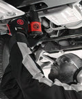 1/2 Inch Air Impact Wrench Packin 960 Ft Lbs Of Raw Torque For Heavy Duty Wheel Removal And Quick Tire Swaps Weighs Just 4.4 Lbs in use under a vehicle.