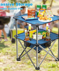 Foldable Camping Table With Built In Cup Holders And Food Basket Ultra Lightweight Square Outdoor Picnic Table with snacks in park