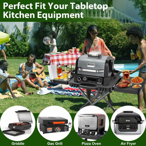 Portable Indoor Grill Table Stand For Ninja Woodfire OG701 OG850 OG951 Series 51 Inch Wide Folding Tailgating Table With 2 Wheels in a picnic setting.