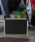 Portable Aluminum Toolbox With Lock Sleek Rigid Case For Small Tools Hardware Gear placed near a car in a garage.