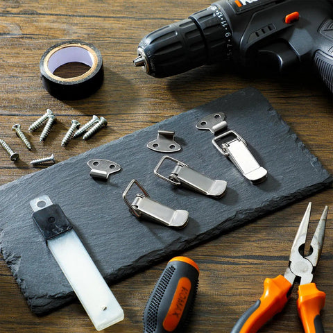 4 Pack Spring Loaded Toggle Latches Stainless Steel Locks displayed with tools and screws on a slate surface