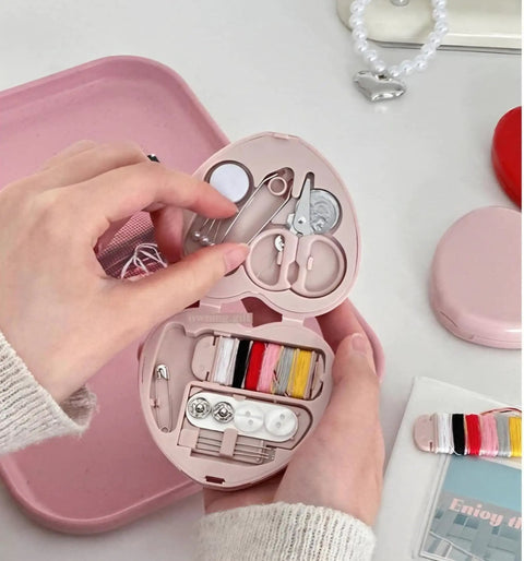 Compact Travel Sewing Kit Two Pack Featuring Adorable Heart Shaped Cases Pink And Blue with sewing essentials open.
