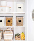 4 Pack Big Food Storage Canisters 5.2L Airtight BPA Free Plastic For Flour Sugar Rice With Lids Includes 4 Measuring Cups And 24 Labels Pantry Organization Black shown in pantry.