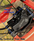 Close-up of black hydraulic disc brake kit for mountain bike with front caliper, showing 74mm size and aluminum components.