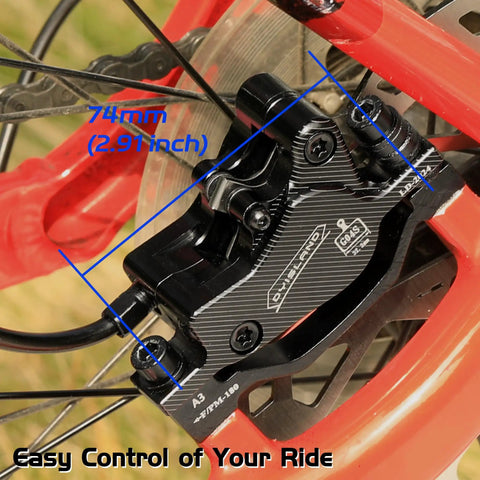 Close-up of black hydraulic disc brake kit for mountain bike with front caliper, showing 74mm size and aluminum components.