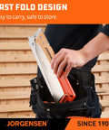 Person placing 9.5 Inch Folding Dovetail Saw With Beech Wood Handle, Pro Japanese Pull Saw With SK5 Steel Blade into tool belt.