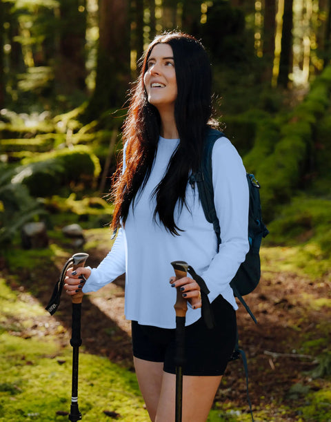 Woman in forest wearing Women's UPF 50+ Long Sleeve Sun Shirt, Lightweight Quick Dry, UV Protection For Hiking And Outdoor Workouts