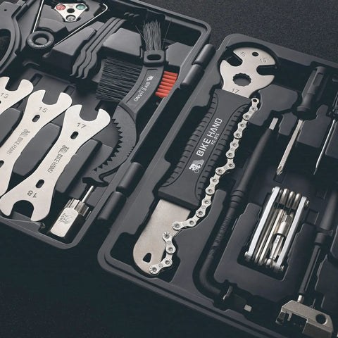 Pro Grade Bike Repair Tool Kit 22 Piece Set For Easy Maintenance And On The Go Fixes in open case displaying tools and chain