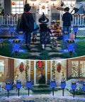 12 Pack Solar Tiki Torch Lights Outdoor Waterproof Blue Flickering Flame For Yard Garden Pathway Patio Ambiance Easy Setup Energy Saving Lit Night Lighting along a decorated holiday pathway.